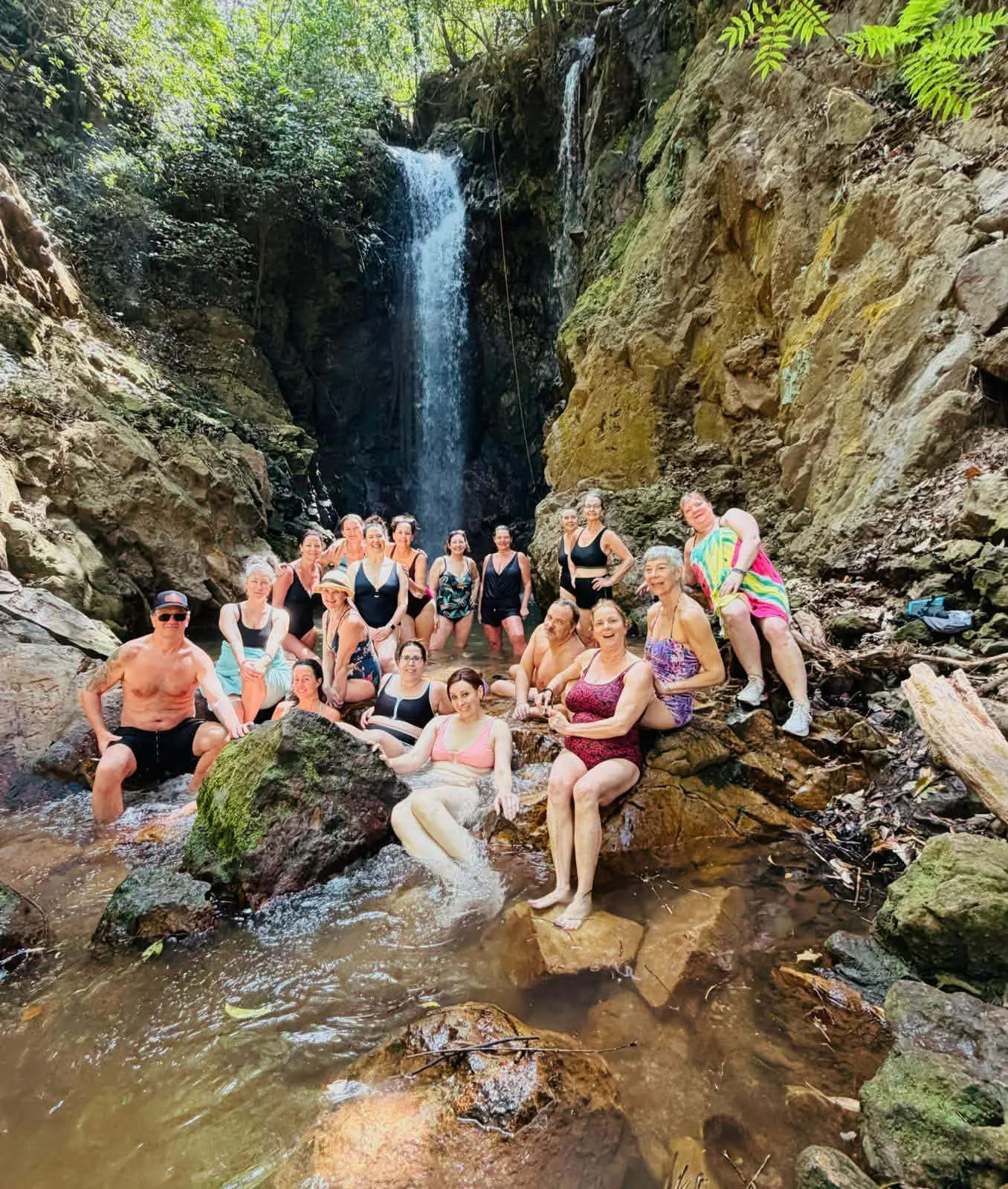 Group retreat guests at AmaTierra waterfall in Costa Rica